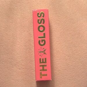 Jeffery Star THE GLOSS Lipstic Gloss. In gold color